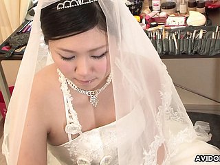 Brunette Emi Koizumi fucked surpassing wedding dress uncensored.